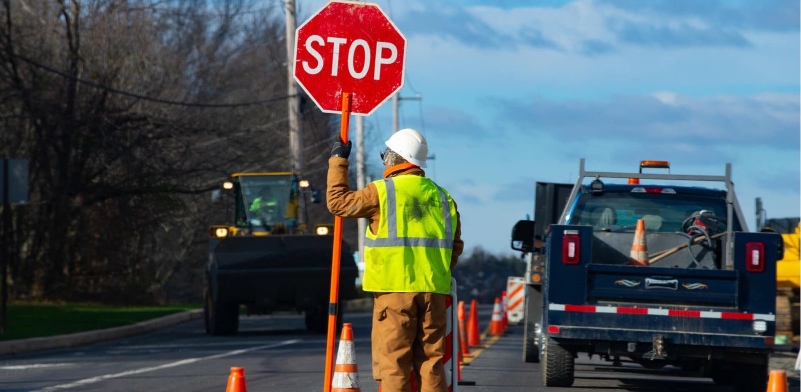 Traffic control worker at a roadside work zone